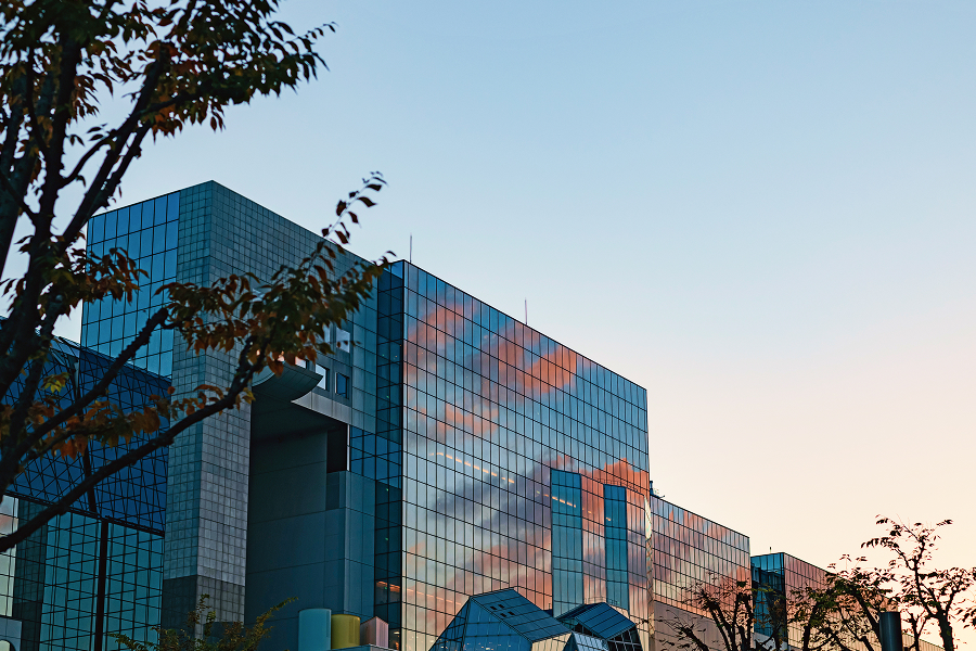 The exterior of Hotel Granvia Kyoto at dusk (a glass-fronted building)