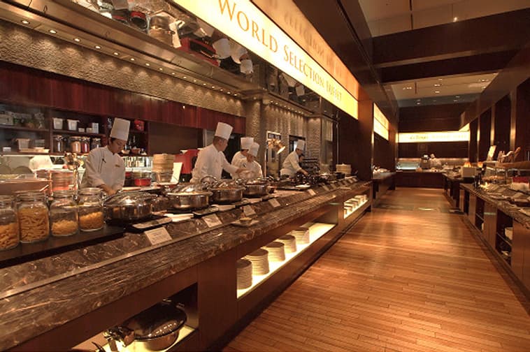The interior of Cafe Restaurant is calm and relaxing, with wood-grain decor and a row of counter seats.