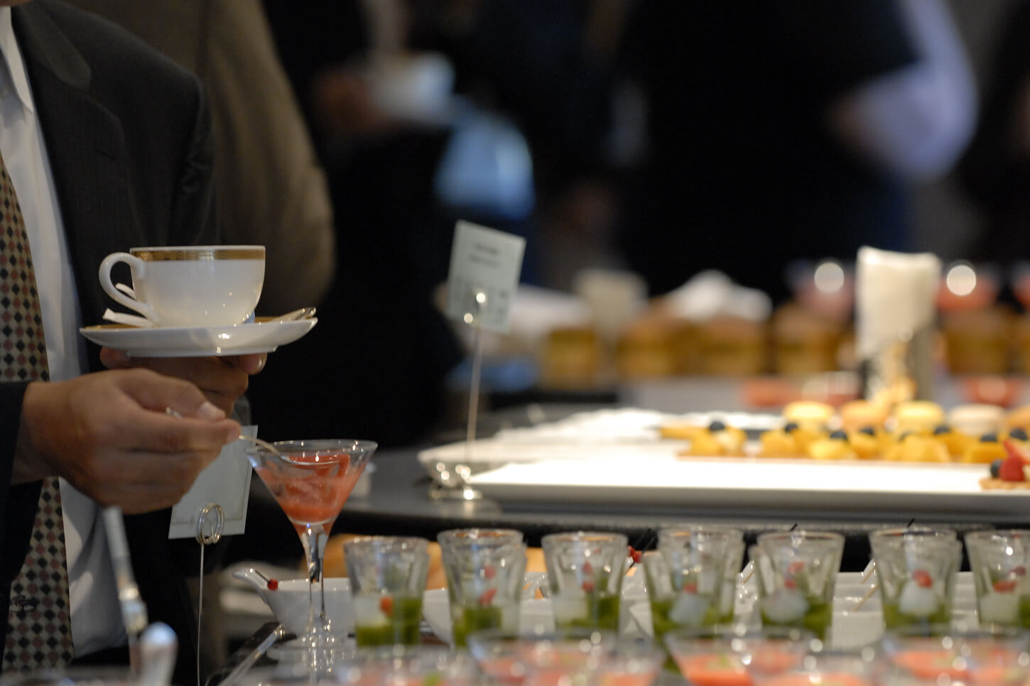 People enjoying a meal at a Standing buffet style venue.