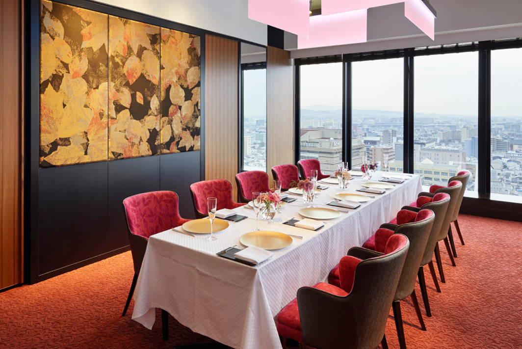 A dining room of Western-style Private Room with a large window overlooking the streets of Kyoto