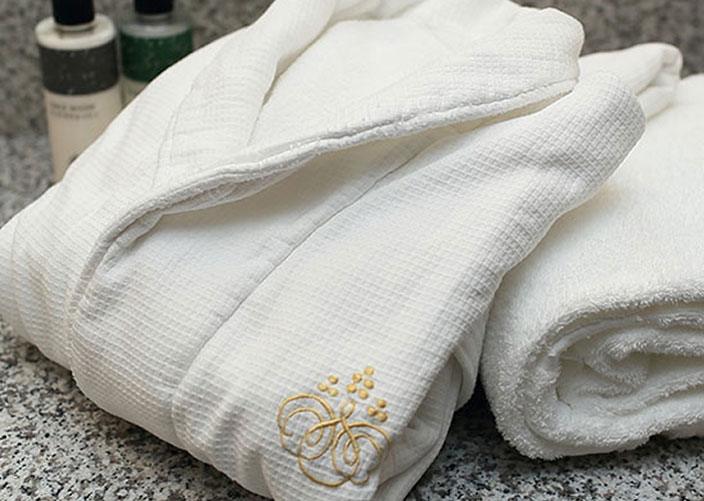 White bathrobe with Granvia logo on the chest