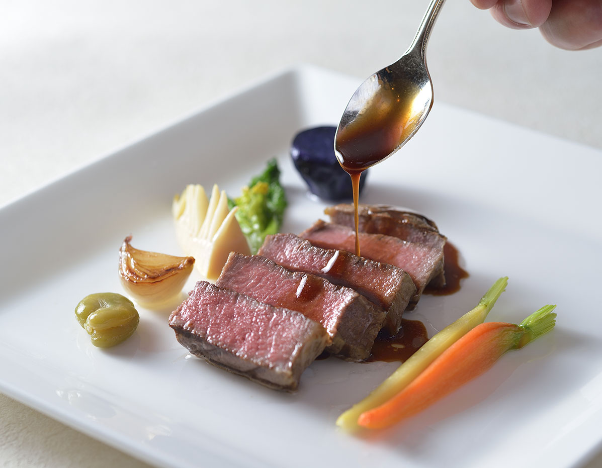 A Western-style main dish featuring foie gras and steak