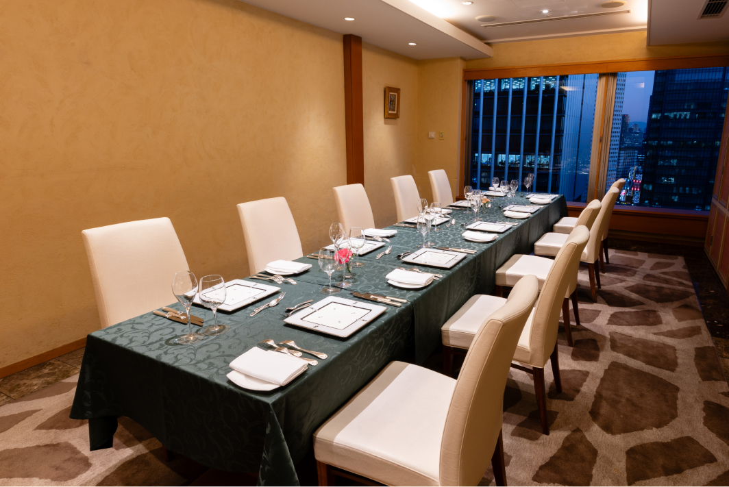 A dining room of Western-style Private Room with a large window overlooking the streets of Kyoto