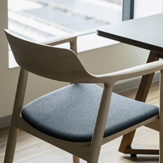 Photo: Room with table, chairs and two beds
